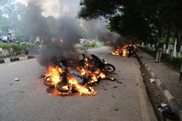 PANCHKULA, INDIA - AUGUST 25: Burning vehicles are seen after Dera followers fire up the vehicles in Panchkula sector 4 after the Dera chief verdict at CBI court on August 25, 2017 in Panchkula, India.