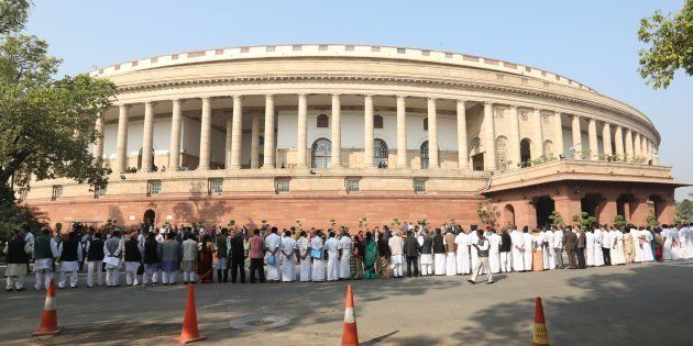Indian opposition politicians take part in a protest calling for Prime Minister Narendra Modi to attend parliament over the ongoing demonitisation process at Parliament House in New Delhi on November 23, 2016. (STR/AFP/Getty Images)