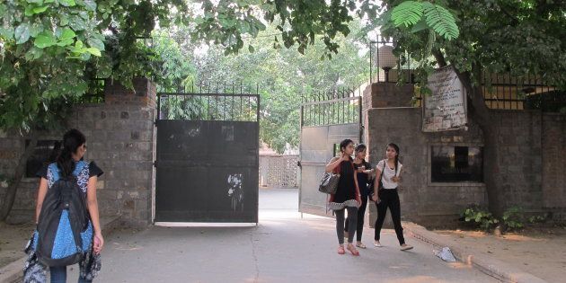 Students in at the gate of the women's dorm of Miranda House, a women's college in Delhi University. In the new, growing campus campaign in New Delhi's colleges called 'Break The Cage', students are protesting strict against women-only dorm rules that bar women from going out at late hours.