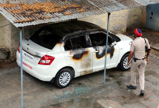 A torched car inside the office of income tax office in Mansa that was set affire by protesting Dera Sacha Sauda protesters at Mansa on August 25, 2017 near Bathinda.