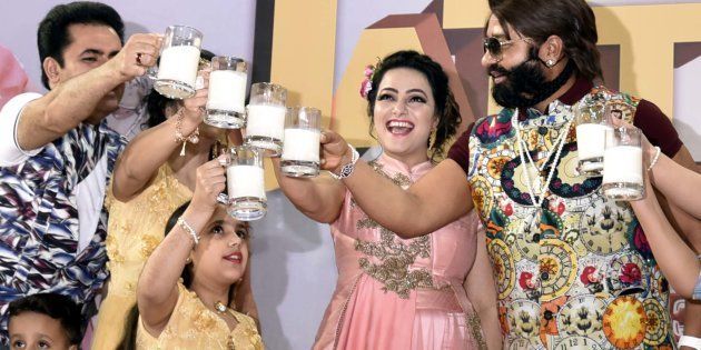 Rape convict Ram Rahim ji Insaan with Honey Preet Insaan during a Cow Milk Party to appeal to Prime Minister Narendra Modi to make cow the National Animal Mother of India, May 2017.