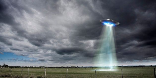 UFO off country road. (Artiste's illustration of imagined UFO.)