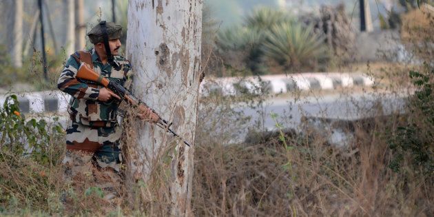 An Indian army soldier stands guard during a gun battle with armed militants at an Indian army base at Nagrota, some 15 kms from Jammu on November 29, 2016. STRINGER/AFP/Getty Images
