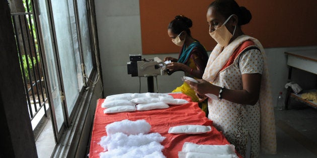 Members of Self Employed Women's Association (SEWA) make low cost sanitary pads at their facility in Ahmedabad on September 3, 2012.