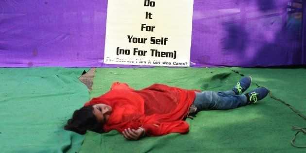 An Indian activist participates in a street play to create awareness on violence against women in New Delhi on December 16, 2014, the second second anniversary of the fatal gang-rape of a student in the Indian capital that unleashed a wave of public anger over levels of violence against women in the country. Women's safety in India has not improved since the fatal gang-rape of a student in New Delhi, the victim's parents said December 16 on the anniversary of the attack that sparked international outrage. AFP PHOTO / SAJJAD HUSSAIN (Photo credit should read SAJJAD HUSSAIN/AFP/Getty Images)