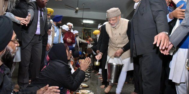 Amritsar: Prime Minister Narendra Modi serves langar during his visit at Golden temple on the eve of the Heart of Asia Conference, in Amritsar on Saturday.