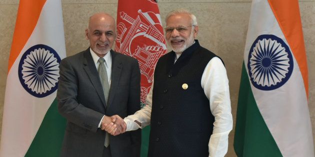 Indian Prime Minister Narendra Modi (R) shakes hands with Afghan President Ashraf Ghani (L) during the 6th Heart of Asia Ministerial Conference in Amritsar on December 4, 2016.