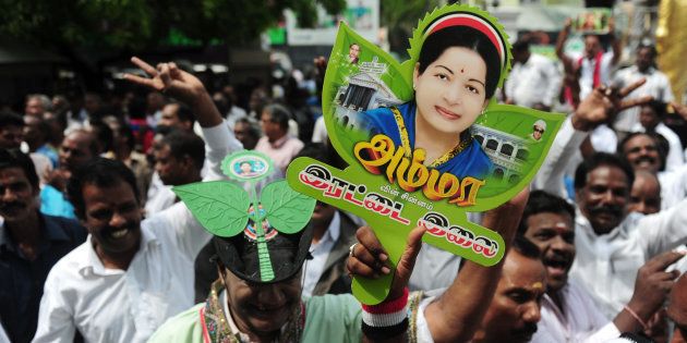 Members of AIADMK party carry placards with the image of Jayalalithaa. ARUN SANKAR/AFP/Getty Images