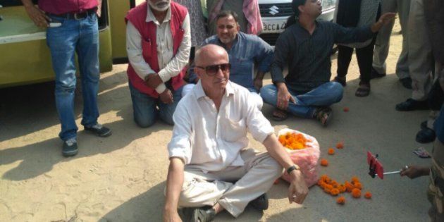 Author and activist Harsh Mander, along with other Karwan-e-Mohabbat activists, sits in a dharna at the spot where Pehlu Khan was killed.