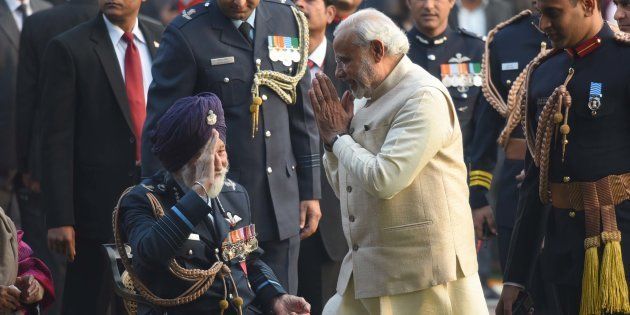 NEW DELHI, INDIA - JANUARY 26: Prime Minister Narendra Modi greets Marshal of the Indian Air Force, Arjan Singh, during 'At Home' reception at President's House, on January 26, 2016 in New Delhi, India.