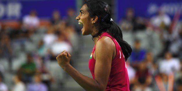 India's Pusarla V. Sindhu reacts to a point against Japan's Nozomi Okuhara during the women's singles final match at the Korea Open Badminton Superseries in Seoul on September 17, 2017. / AFP PHOTO / JUNG Yeon-Je