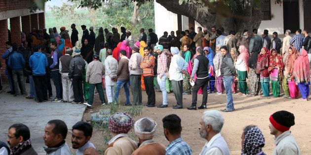 Voters line up to cast their votes outside a polling station during the state assembly election in the northern state of Punjab, in the village of Nada, India, February 4, 2017.
