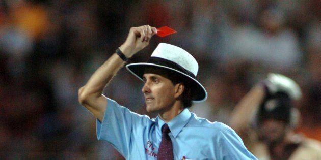AUCKLAND, NEW ZEALAND - FEBRUARY 17: Umpire Billy Bowden shows Australian bowler Glen McGrath (not in picture) a red card