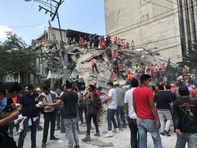 People work at the site of a collapsed building after an earthquake hit in Mexico City
