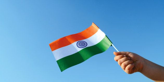 Hand holds the Indian flag on 26th January, India