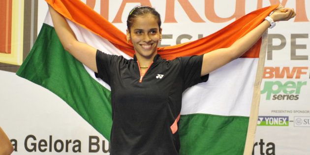 File photo - India's Saina Nehwal waves the Indian flag during the women's singles final medal ceremony at the Indonesian Open 2009 badminton competition in Jakarta on June 21, 2009 against China's Lin Wang.