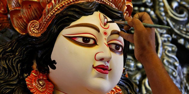 Representative image. An artisan applies finishing touches on an idol of the Hindu goddess Durga, before it is transported to a pandal, or a temporary platform, ahead of the Durga Puja festival in Kolkata, India September 21, 2017. REUTERS/Rupak De Chowdhuri