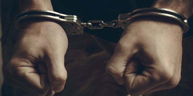 Male hands in handcuffs