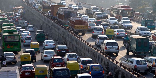 File photo - Traffic moves along a busy road in New Delhi.