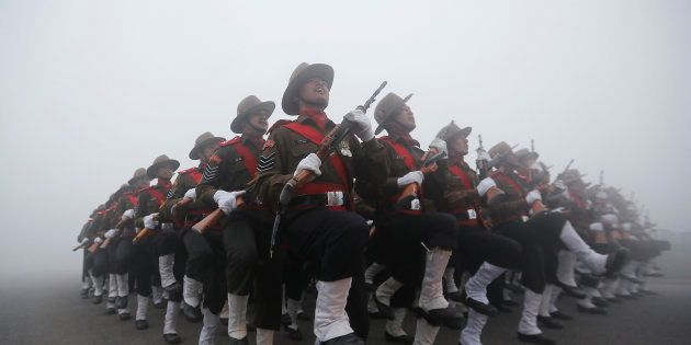 Indian soldiers take part in the rehearsal for the Republic Day parade on a foggy winter morning in New Delhi.