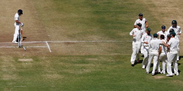 FILE PHOTO: Australia's players celebrate the wicket of India's captain Virat Kohli at the Maharashtra Cricket Association Stadium, Pune.