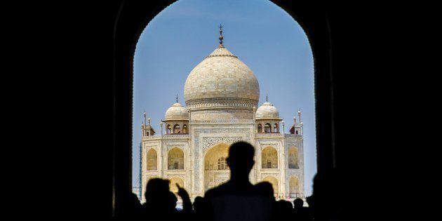 Tourists are seen as renovation process continue at Taj Mahal, one of the wonders of the world, in Agra, India on April 29, 2017.