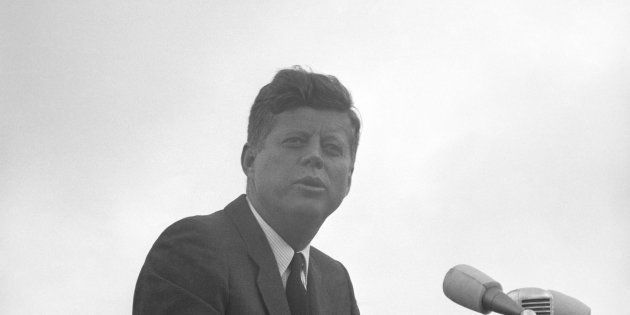 President John F. Kennedy of America acknowledges the cheers of the crowd when he visits New Ross, Co. Wexford, Ireland.