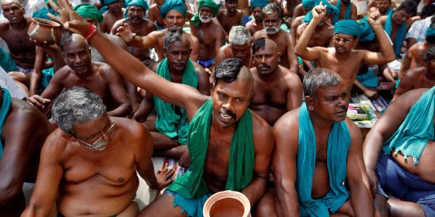 Farmers from Tamil Nadu pose half-shaved during a protest demanding a drought-relief package from the federal government, in New Delhi, India April 3, 2017. REUTERS/Cathal McNaughton