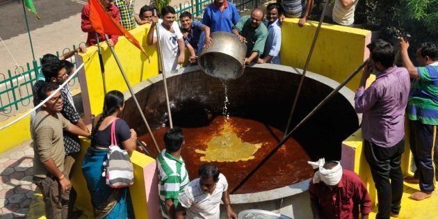 BHOPAL, INDIA - OCTOBER 15: 8501 kg 'Khichdi' being cooked in a 12500 litre cauldron to mark completion of 7 years of Sri Sai Baba Handi wale temple at the locality at Awadhpuri , BHEL Area, on October 15, 2014 in Bhopal, India. Khichdi is derived from Sanskrit word Khicca which refers to a dish prepared from rice and pulses. (Photo by Praveen Bajpai/Hindustan Times via Getty Images)