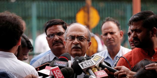FILE PHOTO: Prashant Bhushan, a senior lawyer, speaks with the media after a verdict on right to privacy outside the Supreme Court in New Delhi, India August 24, 2017. REUTERS/Adnan Abidi