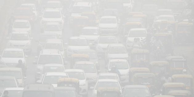 Vehicles drive through heavy smog in Delhi, India, November 8, 2017.