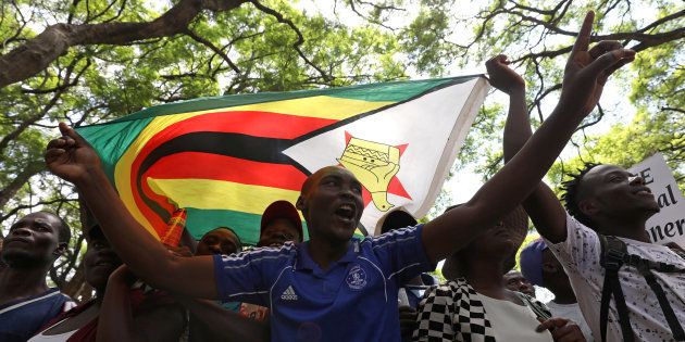 Protesters call for Zimbabwean President Robert Mugabe to resign across the road from parliament in Harare, Zimbabwe, November 21, 2017.
