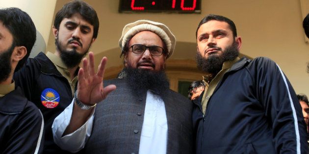 Hafiz Saeed speaks with supporters after attending Friday Prayers in Lahore, Pakistan November 24, 2017. REUTERS/Mohsin Raza