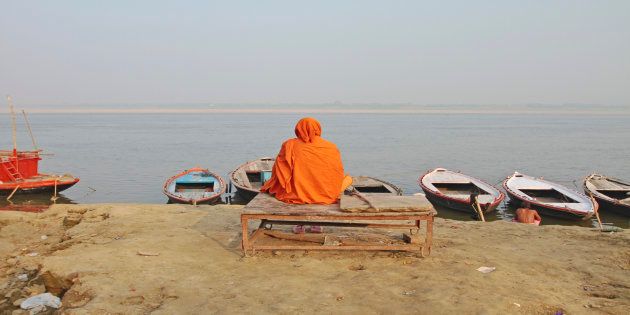 REPRESENTATIVE IMAGE of a sadhu sitting on a wooden bank in Varanasi, Uttar Pradesh.