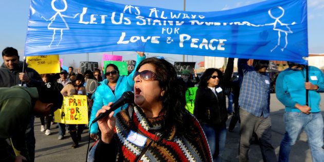Hira Nair leads a chant during a march before a vigil for Srinivas Kuchibhotla, an Indian engineer who was shot and killed, at a conference center in Olathe, Kansas, U.S., February 26, 2017. REUTERS/Dave Kaup