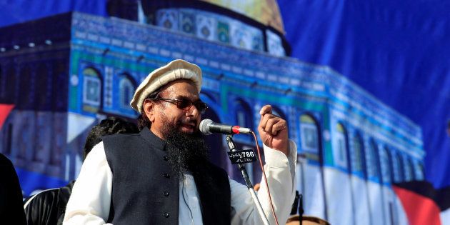 Hafiz Muhammad Saeed (C), chief of the Islamic charity organisation Jamaat-ud-Dawa (JuD), speaks to supporters during a gathering to protest against Trump's decision to recognise Jerusalem as the capital of Israel, in Rawalpindi, Pakistan December 29, 2017.