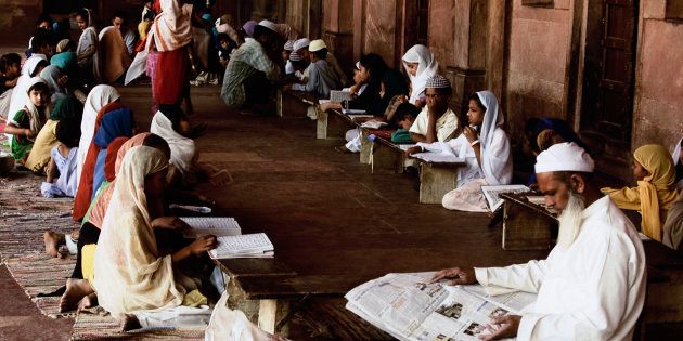 Students studying in madrasa, Agra, Uttar Pradesh, India. (Photo by: Exotica.im/UIG via Getty Images)