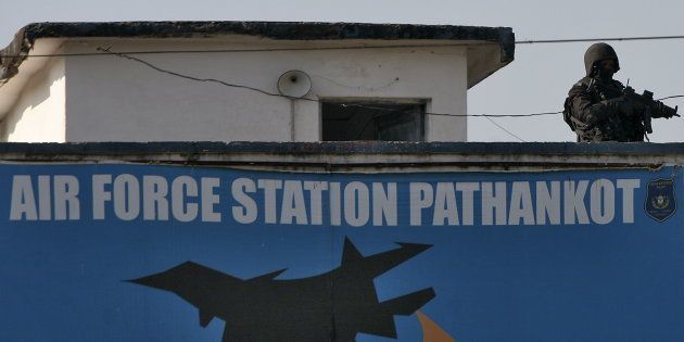 An Indian security personnel stands guard on a building at the Indian Air Force (IAF) base at Pathankot in Punjab, India, January 5, 2016.