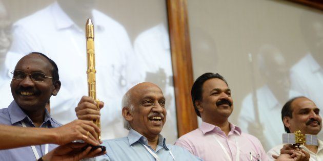 Indian Space Research Organisation (ISRO) chairman Kiran Kumar Reddy (C) gestures while meeting with the media after the Indian Space Research Organisation's (ISRO) earth observation satellite CARTOSAT-2, on board the Polar Satellite Launch Vehicle (PSLV-C40), along with 28 satellites from six foreign countries, including the US, France, Finland, Republic of Korea and Canada, was launched at Satish Dawan space center in Sriharikota on January 12, 2018.