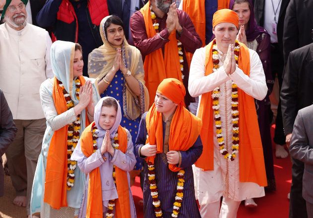 Canadian Prime Minister Justin Trudeau with his wife Sophie Gregoire, daughter Ella Grace and son Xavier greet the people during their visit to the holy Sikh shrine of Golden temple in Amritsar, India on Feb. 21, 2018.