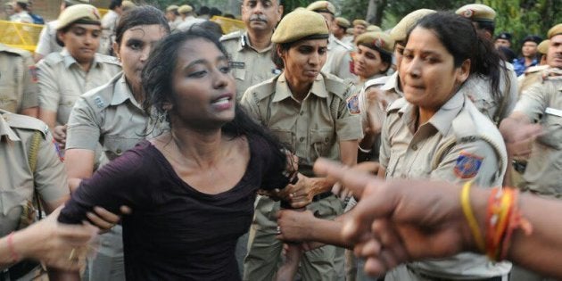 Police drag Dipsita Dhar away.