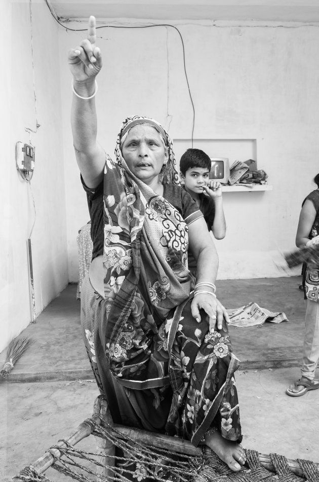 A Thakur woman in Nizampur gestures angrily while talking about how the Dalits were trying to 'break tradition' by parading on a horse.