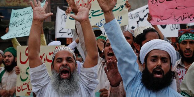 Supporters from various religious groups shout slogans during a demonstration against the sentence of convicted killer Mumtaz Qadri in Lahore October 1, 2011.