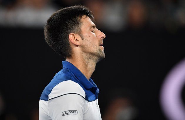 Serbia's Novak Djokovic reacts after a point against South Korea's Hyeon Chung during the Australian Open tennis tournament in Melbourne on January 22, 2018.
