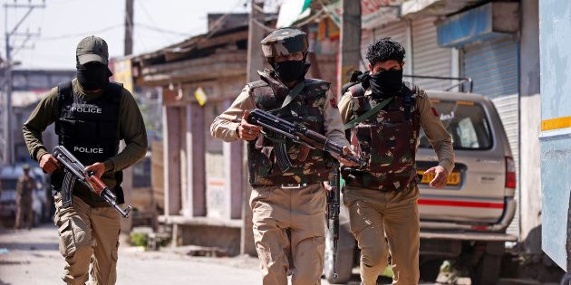Indian army soldiers patrol a street near a site of a gunbattle between Indian security forces and suspected militants in Srinagar.