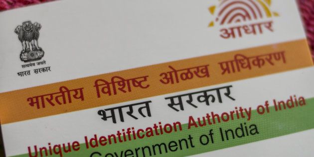 An Aadhaar biometric identity card, issued by the Unique Identification Authority of India (UIDAI), is arranged for a photograph in Mumbai, India, on Saturday, Jan. 28, 2017.