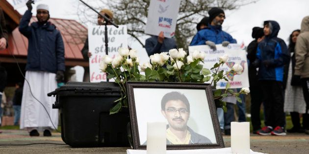 A photo of Srinivas Kuchibhotla, the 32-year-old Indian engineer killed at a bar in Olathe, Kansas, is pictured during a peace vigil in Bellevue, Washington on March 5, 2017.