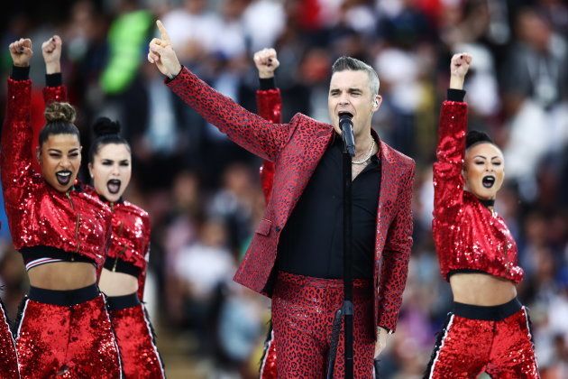British singer Robbie Williams performs at the opening ceremony.