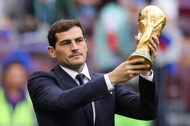 Spanish footballer Iker Casillas holds the 2018 FIFA World Cup trophy during the opening ceremony.