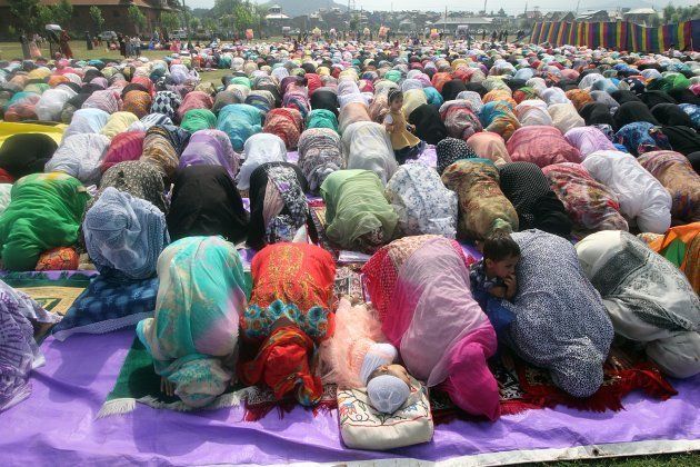 Women offer prayers in Srinagar.